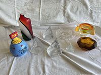 All ten pieces arranged on cloth backdrop