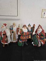 Front view of all five resin Santa/St. Nicholas figurines