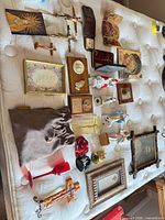 Overview of entire assortment of devotional items laid out on mattress