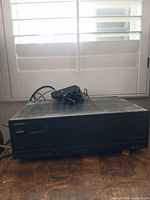 Front view of Onkyo amplifier showing overall wear