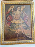 Full frontal view of framed angel painting