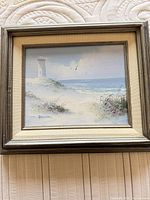 Frontal view of framed seascape painting