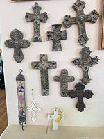 Group of twelve wall crosses displayed