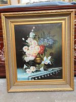 Frontal view of oil painting with gilded frame