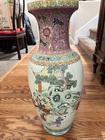 Full view of vase front showing pink neck and main scene