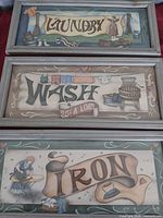 All three framed laundry-themed signs stacked