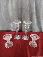 Group shot of all four clear glass/crystal candlesticks