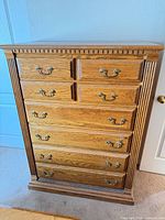 Front view showing entire oak dresser and drawer layout