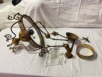 Overall view of chandelier components laid out on table