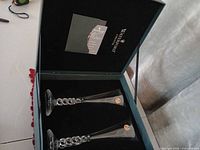 Open Waterford box showing two champagne flutes and booklet