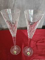 Front view of both Waterford crystal champagne flutes showing pattern and stickers