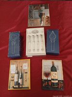 Overview of both plaques, utensil set in open box, additional original boxes