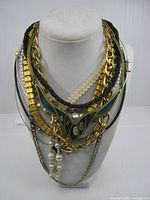 All necklaces layered on bust form front view