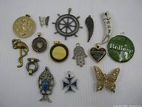 Full group of fifteen pendants on white background