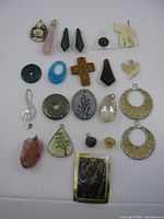 All twenty-two assorted pendants laid out in rows for overview