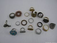 Group shot of all 18 varied rings displayed on white background