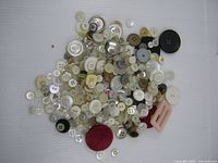 Overhead view of entire lot showing quantity and variety of buttons