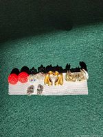 Front view of all six earring pairs on display strip