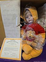 Doll in box with certificate and plush Pooh