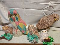 Group shot of all six owl figurines