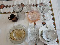 Full view of all glass and china pieces on tablecloth