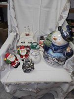 group shot of all eight Christmas decor items on chair