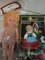 Blonde doll in sealed bag with Gretel booklet
