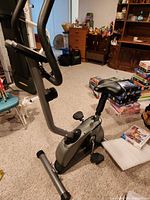 Side view of Free Spirit upright exercise bike showing frame, pedals, seat and resistance knob