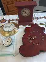 Group shot of all four clocks on table