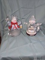 Both snowman figurines together for scale and comparison