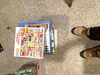 Stack of six boxed 1000-piece food theme jigsaw puzzles, top box shows White Mountain collage of food brand labels
