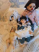 Group shot of four porcelain dolls