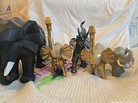 Group shot of all five elephant figurines