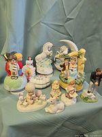 Group shot of all ten figurines displaying size, colour and themes