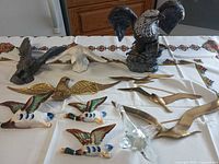All nine bird décor items displayed on table