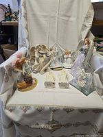 All nine angel figurines arranged on chair