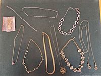 Overview of all necklaces laid out showing styles, lengths and finishes