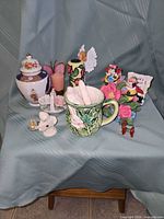 Overall lot view with all nine decorative items displayed