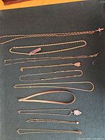 All necklaces laid out to show quantity, styles and pendants