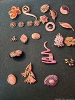 All jewellery pieces laid out on green background