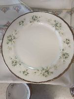 Single Paragon dinner plate showing floral pattern and gold rim