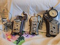 All four elephant figurines lined up