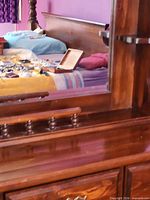 Close view of dresser top surface and attached mirror frame