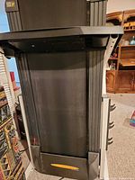 Folded Weslo treadmill front view showing running deck and console area