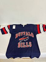 Front view of navy Buffalo Bills jersey with team name and logo visible