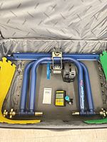 Trainer frame, resistance unit, head unit, skewer, adapters packed in suitcase