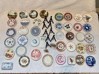 Overview of entire lot showing all plates, tile and stands