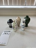 Group shot of five miniature porcelain bud vases