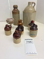 Group shot showing all stoneware jugs, crocks and glass goblet