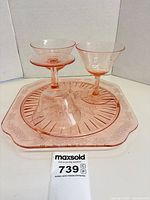 Tray with three coupes displayed on top